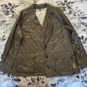 Size large but fits like a very loose large.    Gray green color.